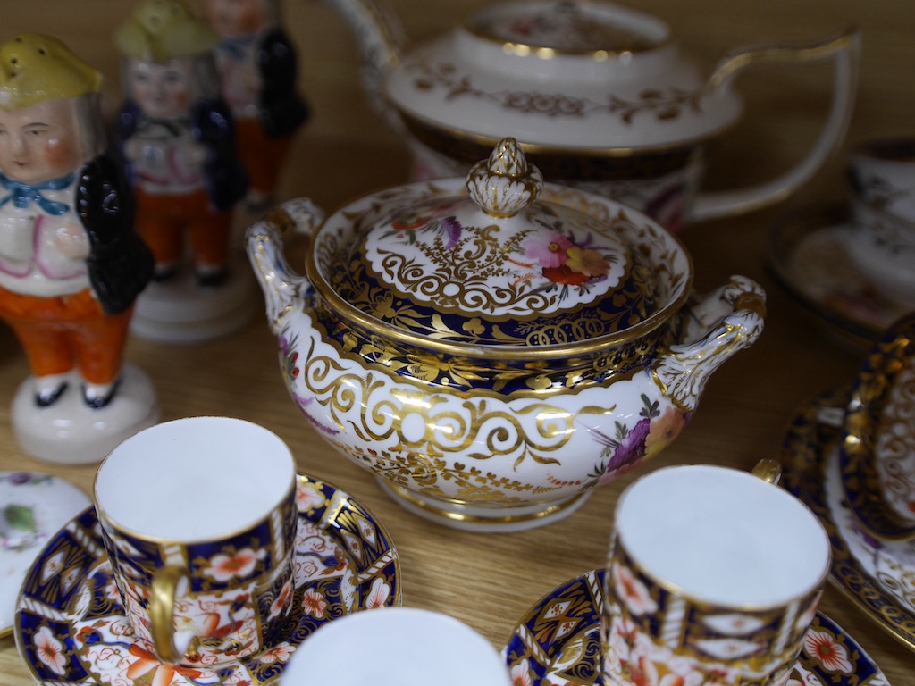 An English part teaset, c.1825 and six Royal Crown Derby coffee cans and saucers etc. Condition - some items cracked chipped and losses to gilding, teapot cover finial broken